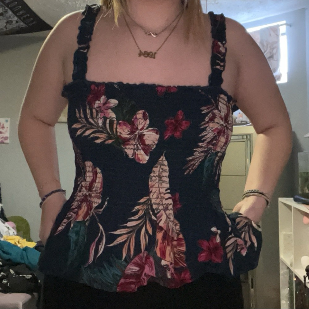 Navy color with Hawaiian flowers, skirt like bottom on the shirt